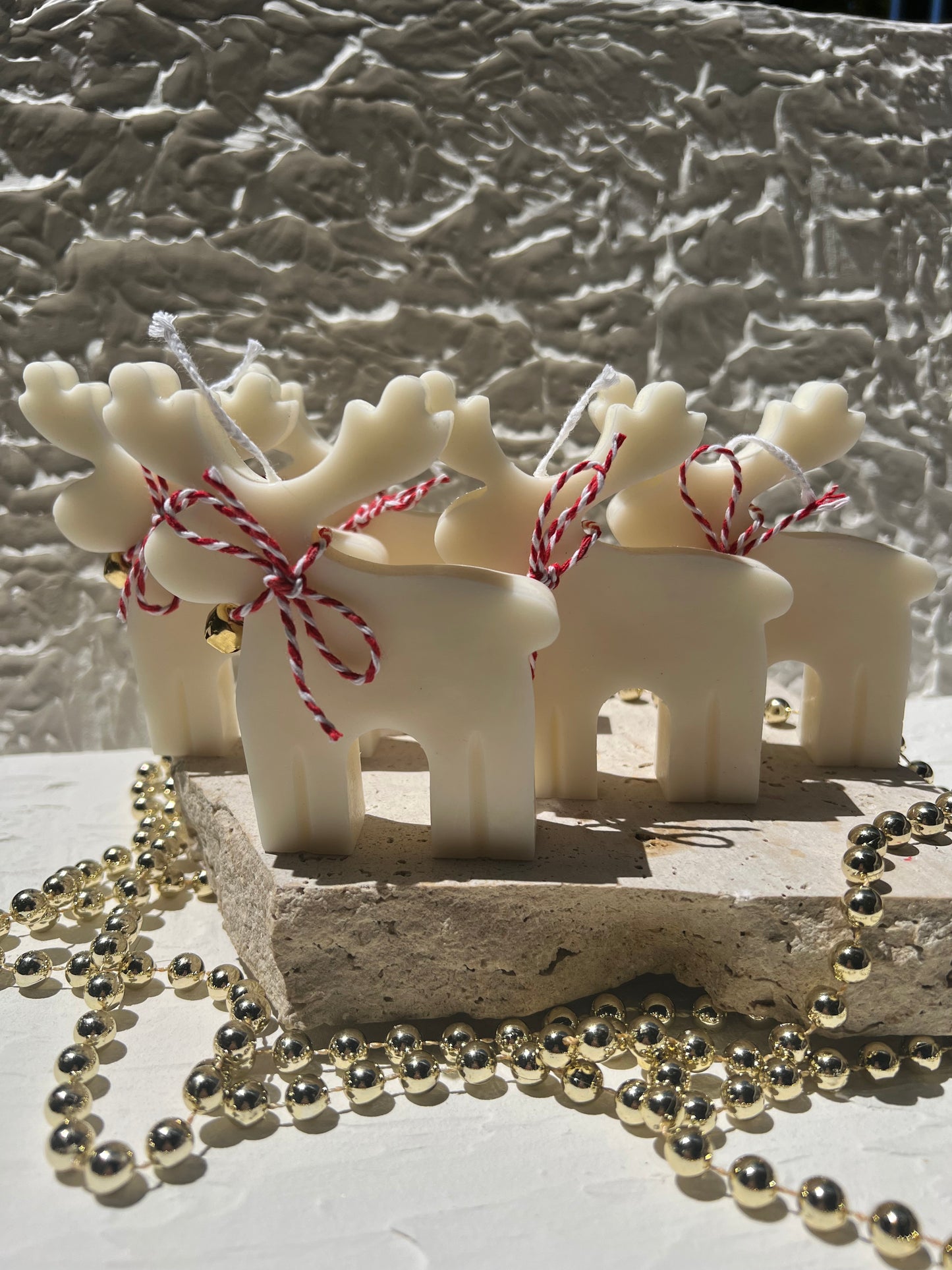 Classiicollection's handcrafted scented rainbow reindeer candles, front picture